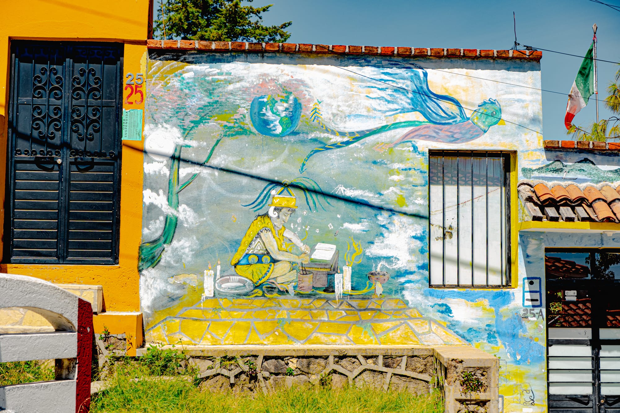 Street art mural along the zigzagging staircase to Iglesia de San Cristóbalito in San Cristóbal de las Casas, Chiapas, Mexico, depicting Indigenous imagery painted on a hillside neighborhood wall