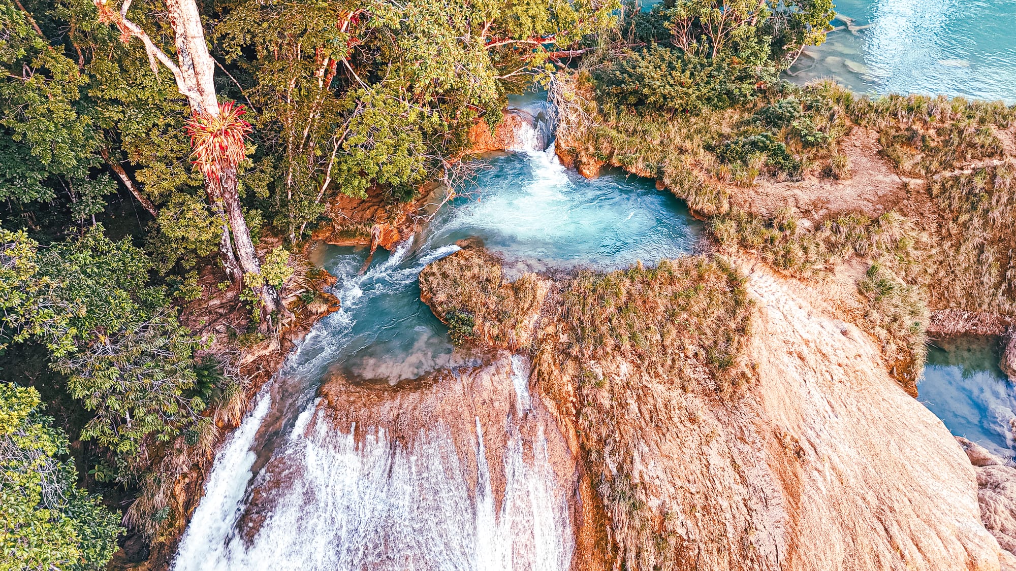 Cascadas Roberto Barrios waterfalls near Palenque, Chiapas, Mexico, turquoise natural pool at the top of limestone cascades, small waterfall feeding into jungle river, Roberto Barrios swimming pools and walkable waterfalls near Palenque