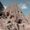 Cone-shaped rock formations with carved entrances at Selime Monastery in Cappadocia, Turkey