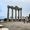 Visitors walk among the five remaining Corinthian columns of the Temple of Apollo in Side, Turkey