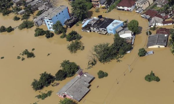 Severe flooding in Ratnapura district, Sri Lanka, with homes and roads submerged after intense monsoon rains, highlighting national climate-risk and landslide vulnerability.