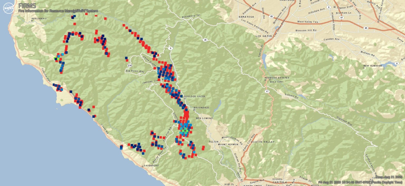 A thinner oval outline of dark blue, red, and orange dots in the northwest, close to the coast.