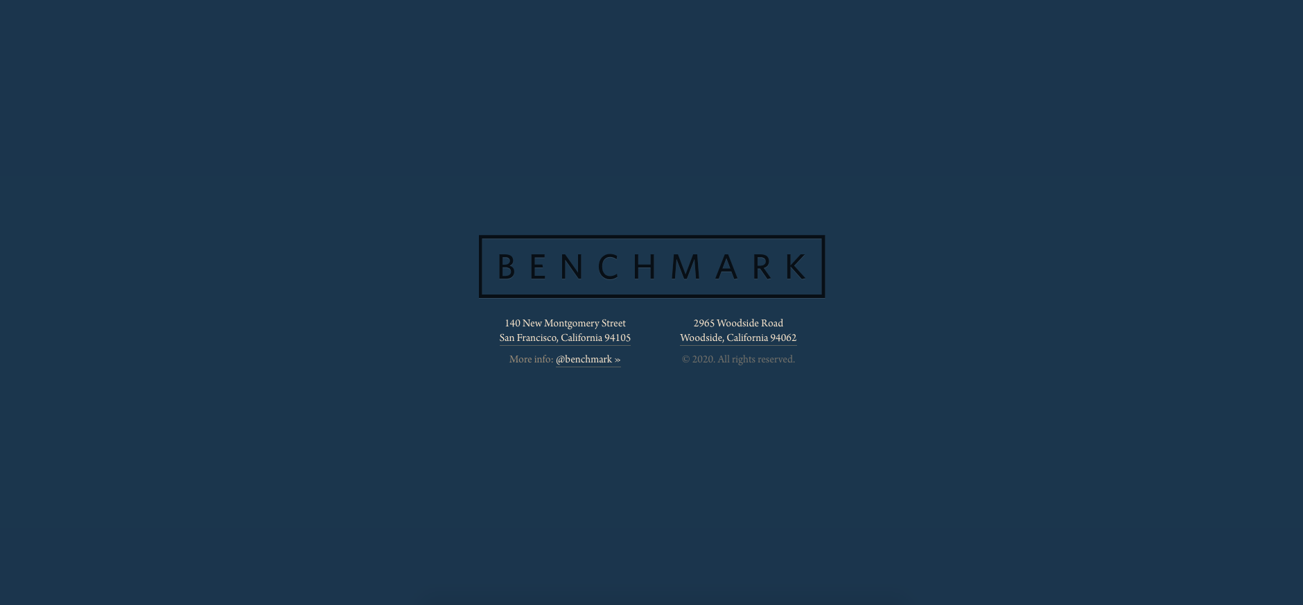 Benchmark’s black logo on a navy blue background. The addresses of their two locations are listed in yellow text.