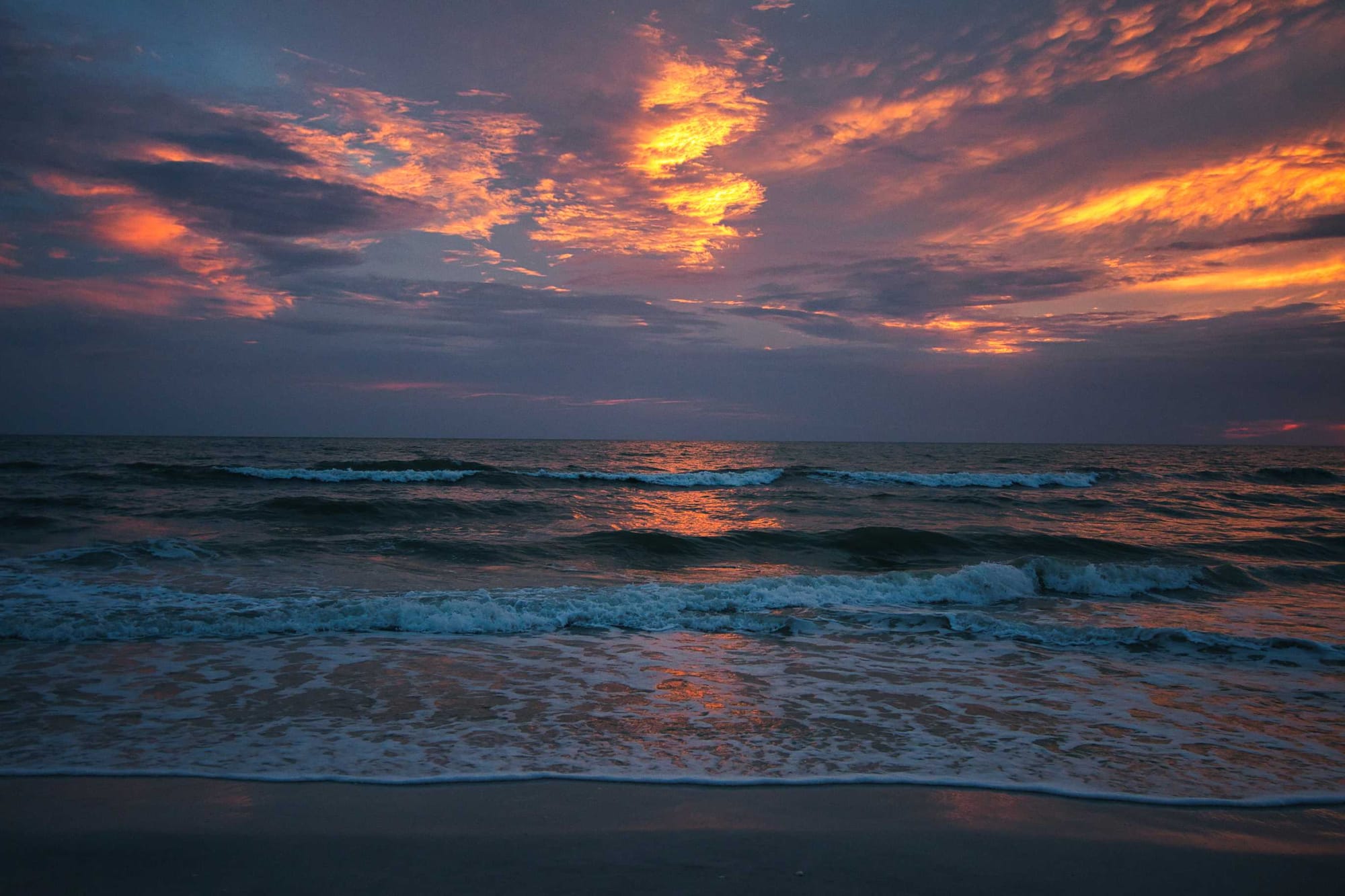 Sunset on a beach in Naples looking west into the Gulf of Mexico
