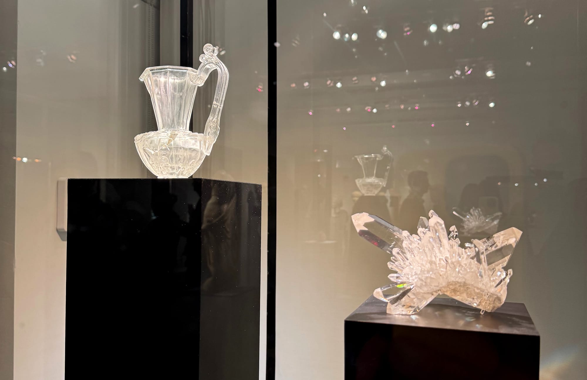 A late Roman or Byzantine oinochoe carved from rock crystal sat beside a large specimen of the same material