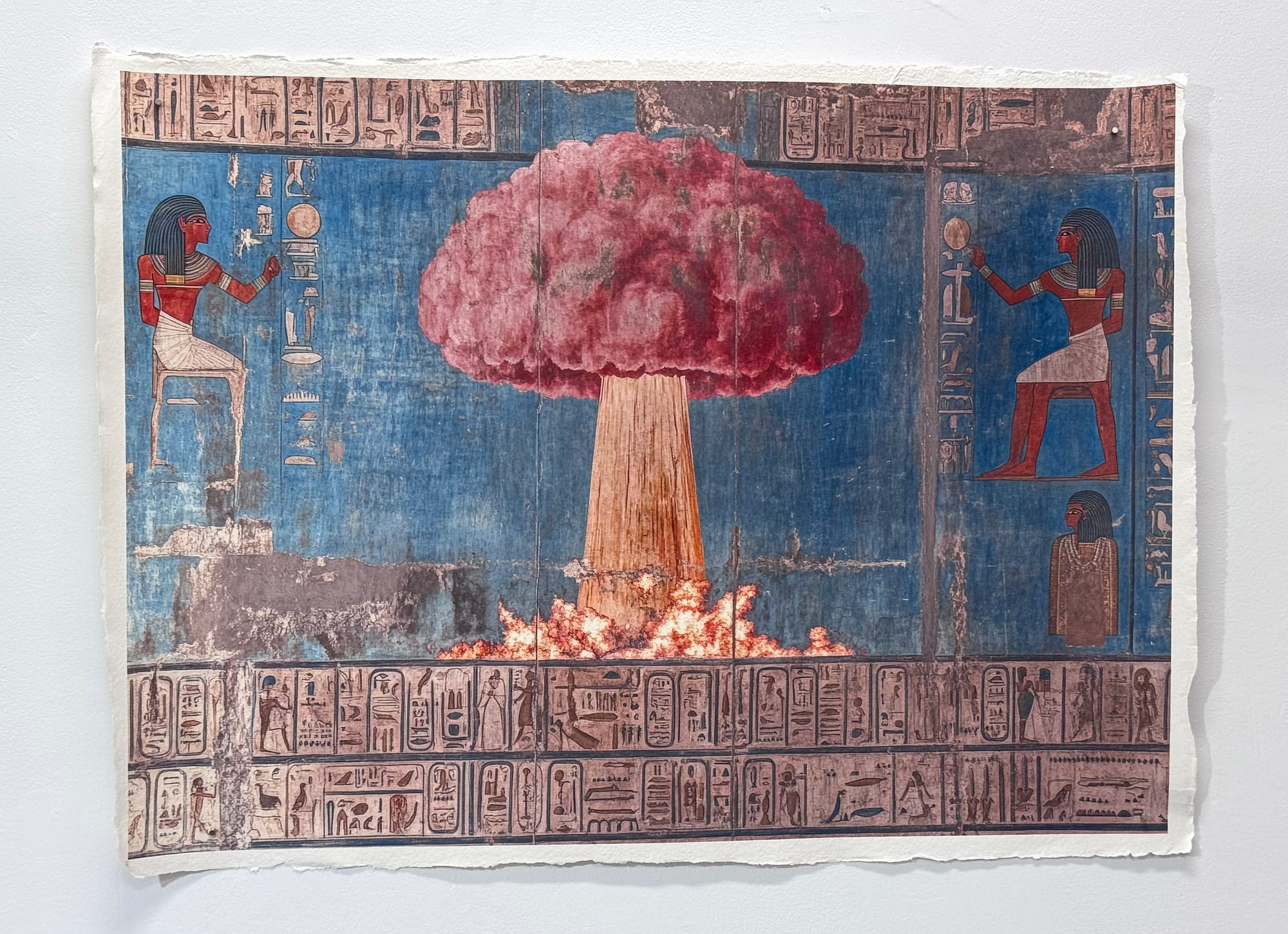 An atomic bomb is pictured against a blue background in an Ancient Egyptian styled artwork made with AI