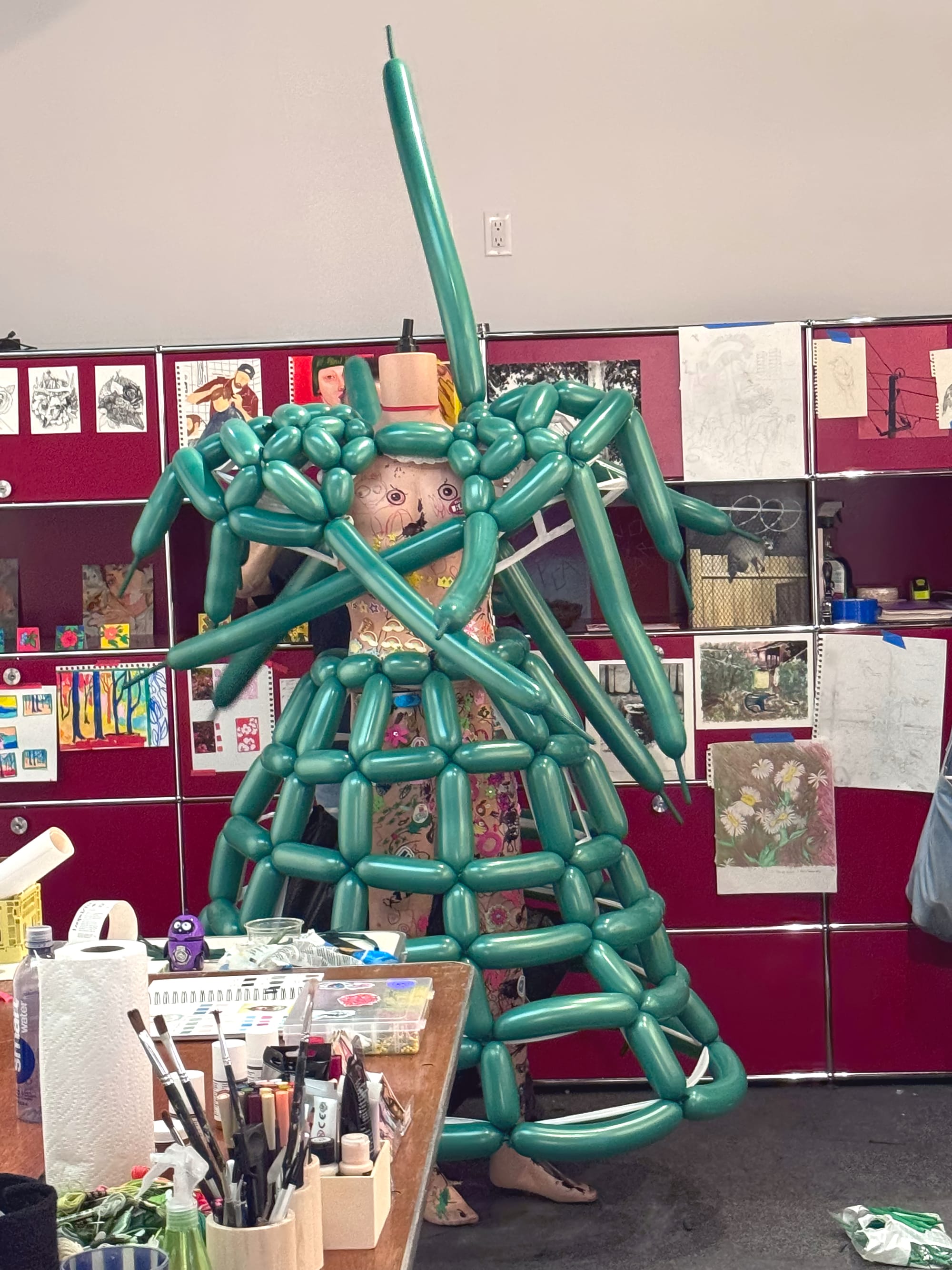 A dress made of green children's balloons is pictured at New York's new participatory art fair Work in Progress on Thursday.