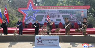 Kim Jong Un pictured shoveling dirt 