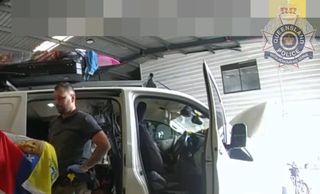 police are pictured recovering artifacts from a camper van