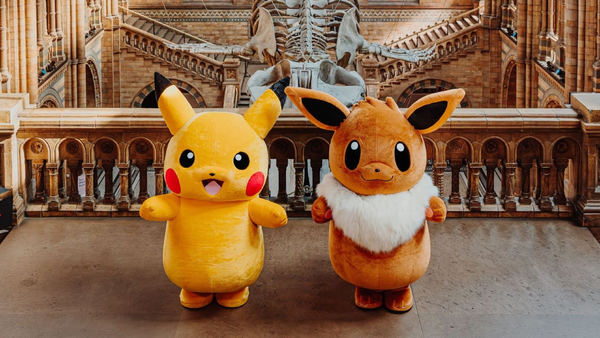Pokémon mascots Pikachu and Eevee stand inside London’s Natural History Museum during a Pokémon pop-up shop collaboration.