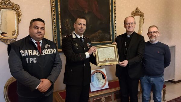 Members of Italy's Carabinieri police force are pictured returning a Pope Clemente X papal bull to church officials.