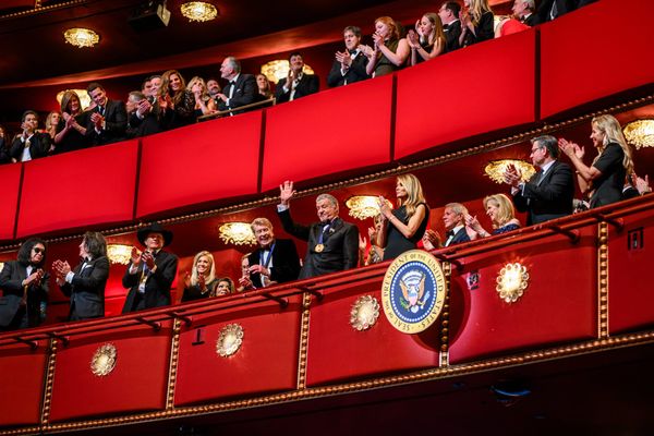 People stand in the balconies at the Kennedy Center