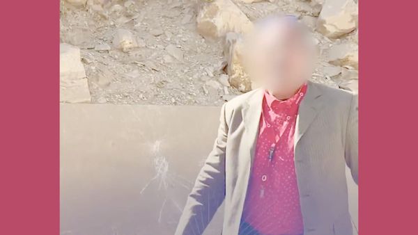 A tour guide and chalk drawings are seen on a pyramid in egypt