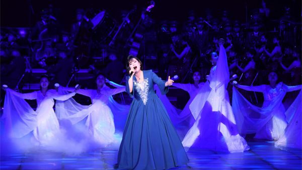 A woman performs onstage in North Korea