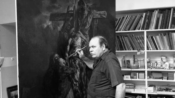 Ben Stahl is pictured painting Descent from the Cross, one of 14 paintings stolen on April 16, 1969