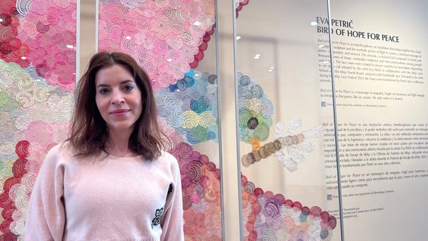 Artist Eva Petrič stands in front of her installation Bird of Hope for Peace at the Narthex Gallery of St. Peter’s Church in New York City. 