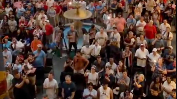Evacuated Trump supporters shelter from thunderstorm in African American museum