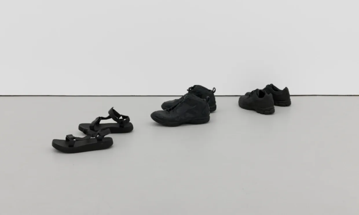 Bronze casts of pairs of shoes, as seen in Fiona Connor's I haven't arrived yet exhibition