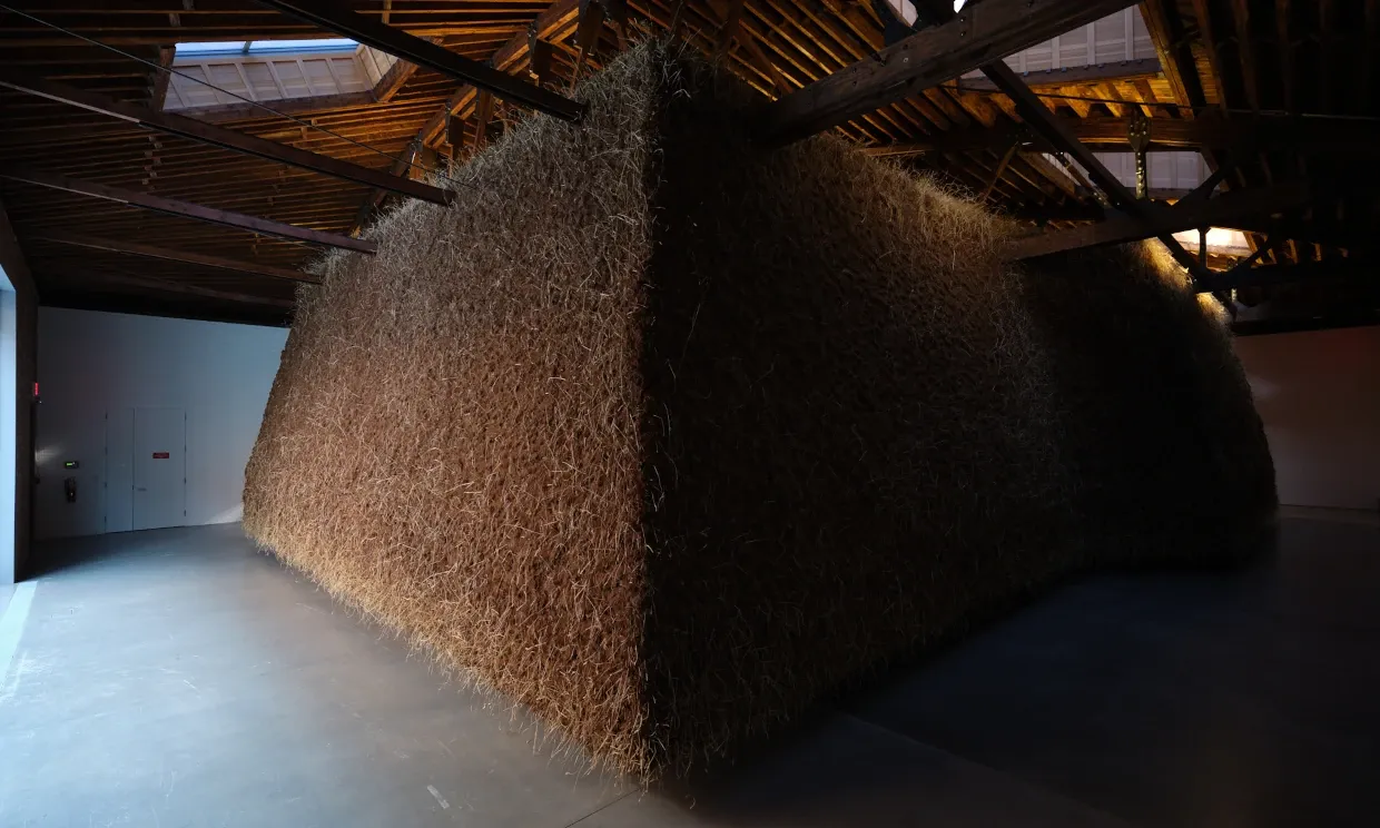 A giant, angular earthen sculpture