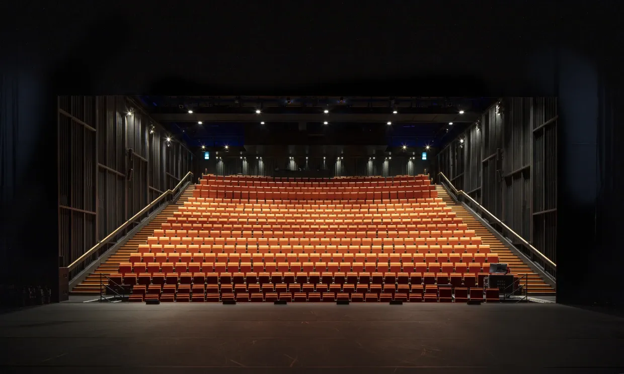 Interior of Riba building, showing rows of red seats