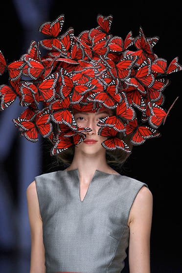 Butterfly headdress of hand-painted turkey feathers Philip Treacy for Alexander McQueen La Dame Bleu Spring Summer 2008. Copyright: Anthea Sims 