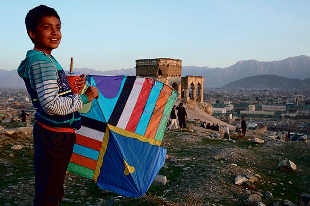 Andrew Quilty - Oculi –Kites from Kabul – V&A Museum of Childhood 620A young kite flier late in the afternoon on a Friday on the hill home to the tomb of Nader Khan Tomb - a popular place for kite flying - in Kabul.