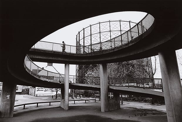 Time to reflect: man on walkway in East London. Photograph: Nicholas Sack
