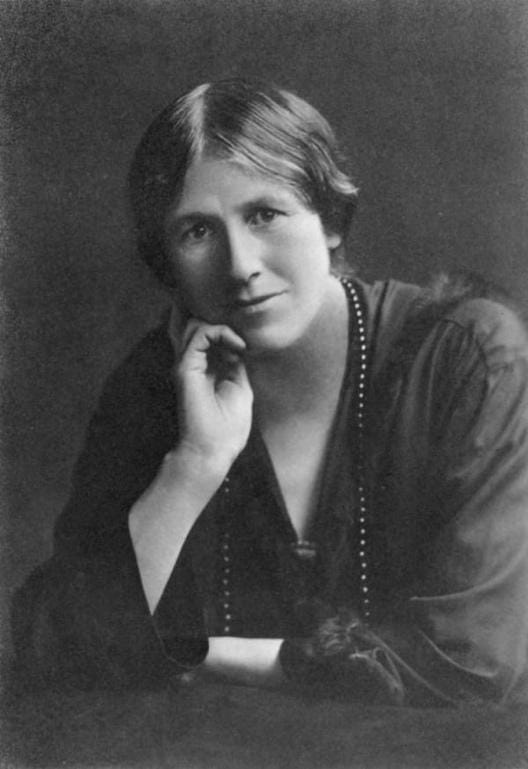 A person with her hand on her chin
Description automatically generated
