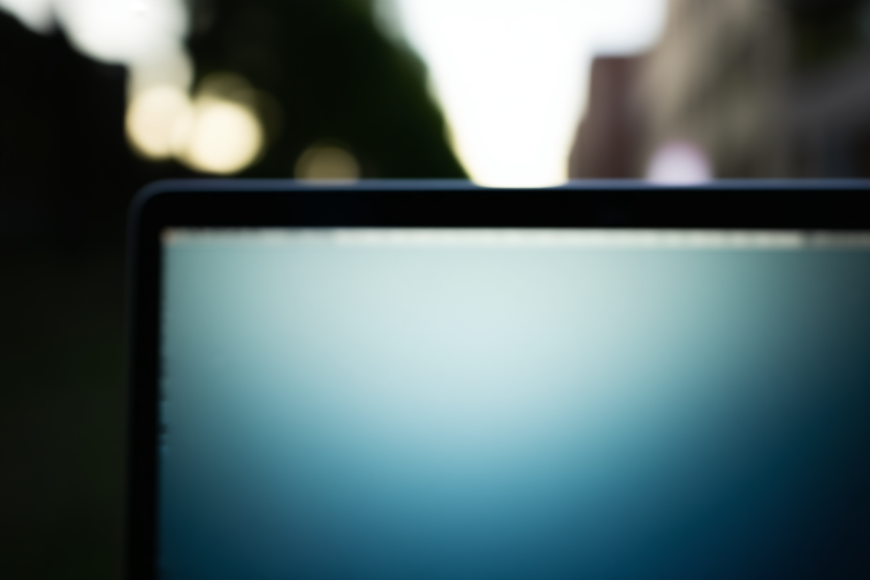 A close-up of a laptop screen displaying a list of trending keywords overlaid on a blurred background of a city street, 