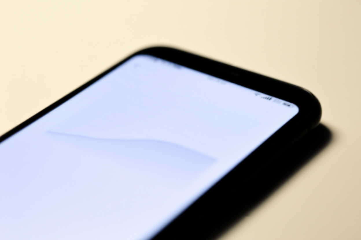 A close-up of a smartphone displaying a comparison chart on a clean background