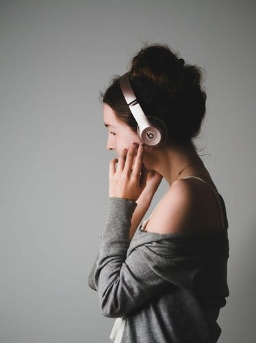 Woman wearing headphones, representing the future of audiobook growth