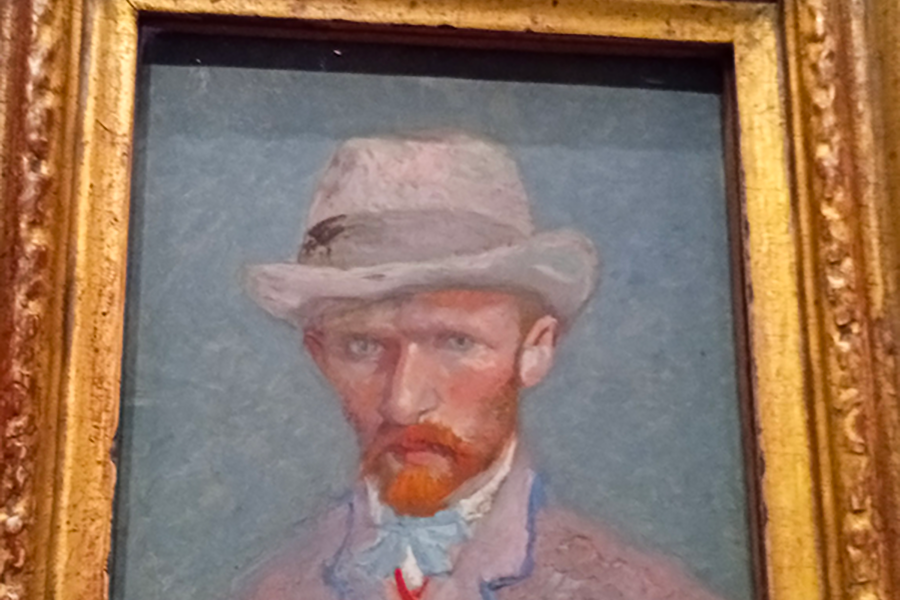 Self-portrait by Vincent van Gogh with an intense gaze and visible brushstrokes expressing inner tension and emotional depth.