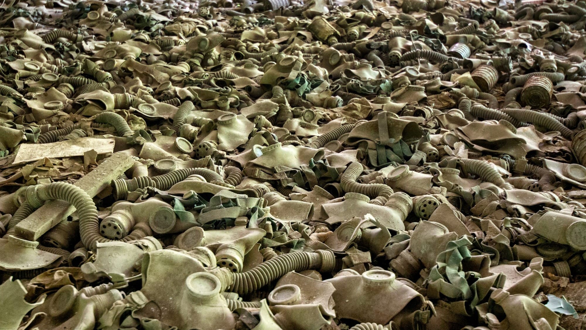 a large pile of old, dirty, and broken objects