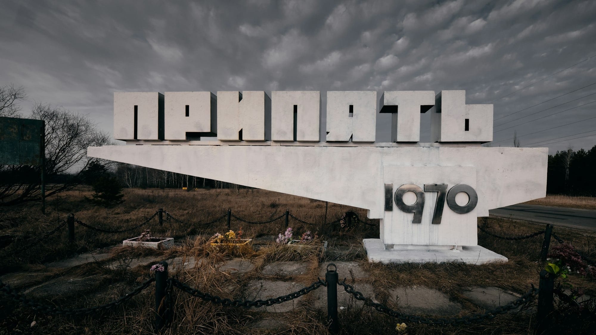 white and black concrete building under gray clouds