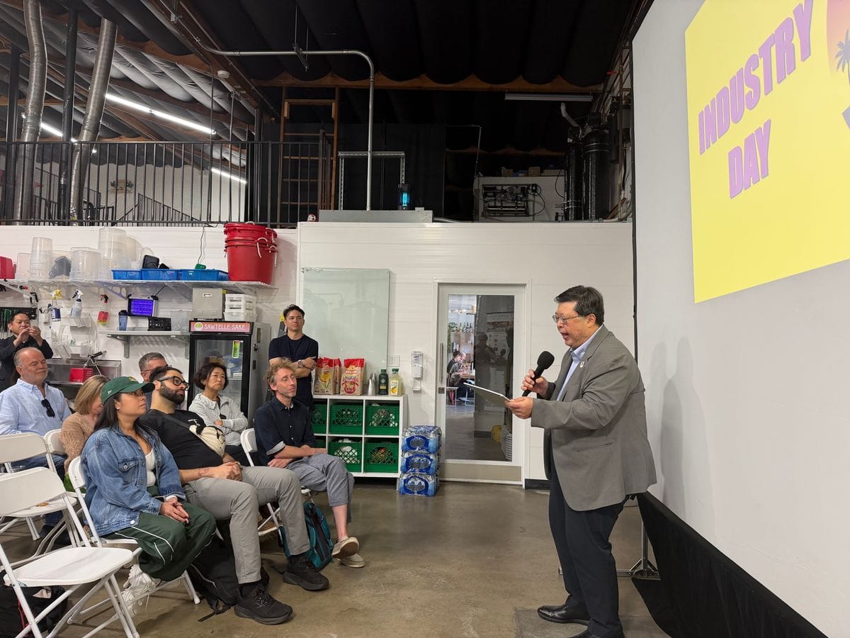 Industry Day speaker addressing attendees inside Sawtelle Sake’s production brewery.