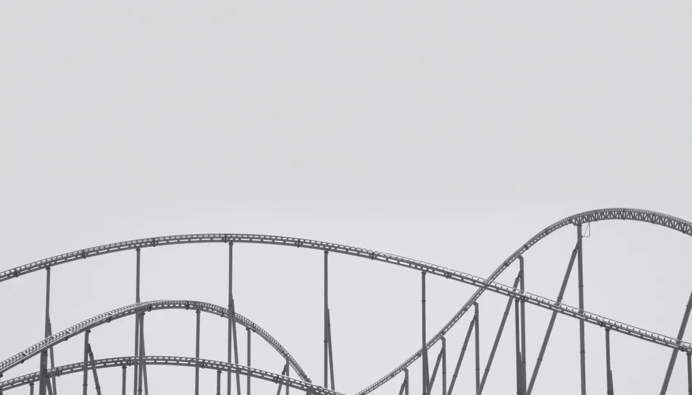 black and white photo of roller coaster track