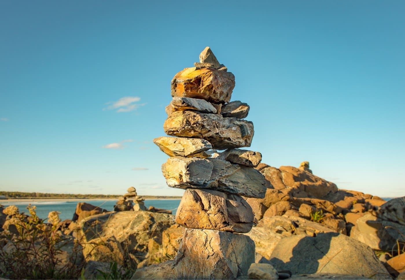 photo of stacked rocks on beach