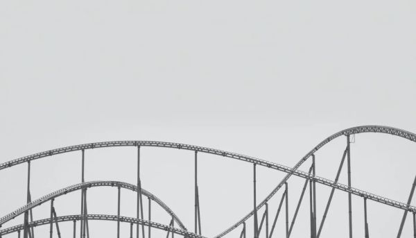 black and white photo of roller coaster track