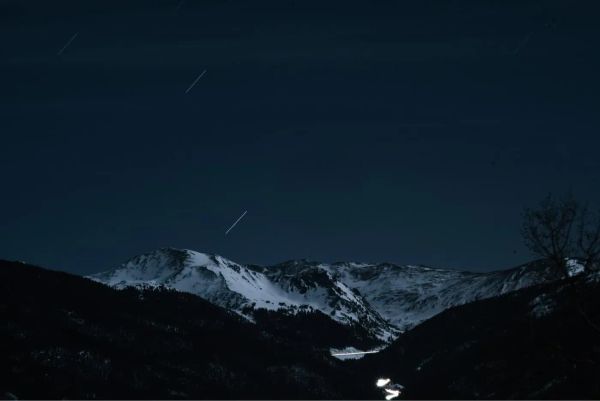 photo of mountains with snow at night