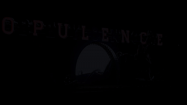a GIF from the Renaissance World Tour in 2023, orchestrated and starring Beyoncé Knowles-Carter; above the stage, the word OPULENCE flashes in bright red neon, alternating with the word BEYONCE in bright white neon. the house and stage lights are down. In the middle of the stage, a half circle is illuminated (this is where the singers, dancers, and some props enter and exit the stage during performances. A woman/cyborg/automatron slides acorss the stage, silhouetted by the lit semicircle. She is giant enough to have her head in the foreground of the words flashing; she looks about languidly, leaning on her side and propped up on her elbow. BEYONCE//OPULENCE flashes all the while.