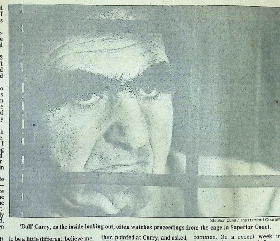 Hartford Courant photo by Stephen Dunn, close-up of Bull Curry's face through the bars of the Superior Court cage, on the inside looking out