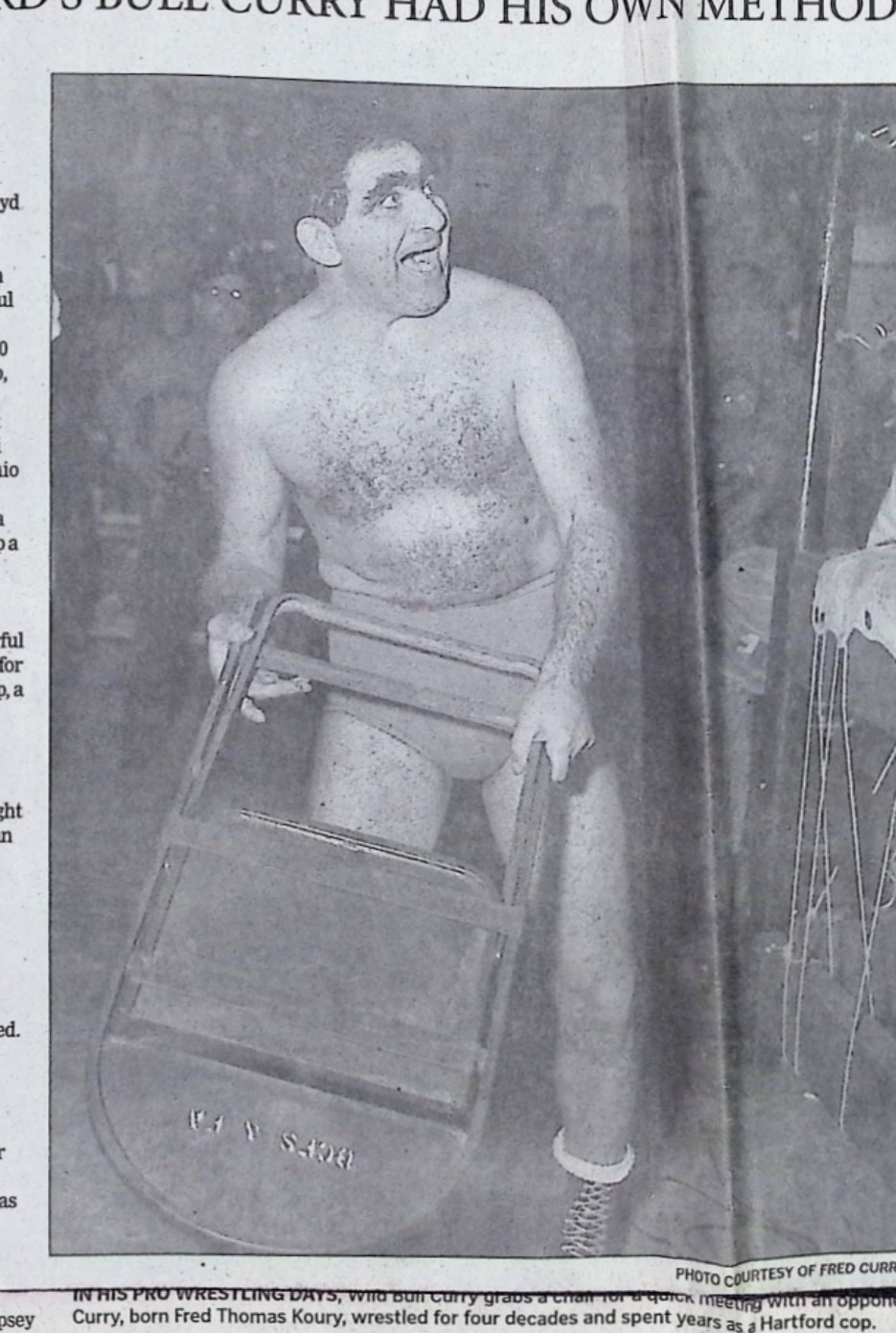 Hartford Courant 2008 photo of Bull Curry in the ring holding a folding chair, printed caption calls it a quick meeting with an opponent