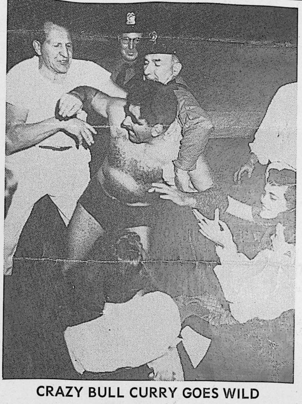 Galveston Wrestling Program front page photo, April 11, 1957, captioned Crazy Bull Curry Goes Wild