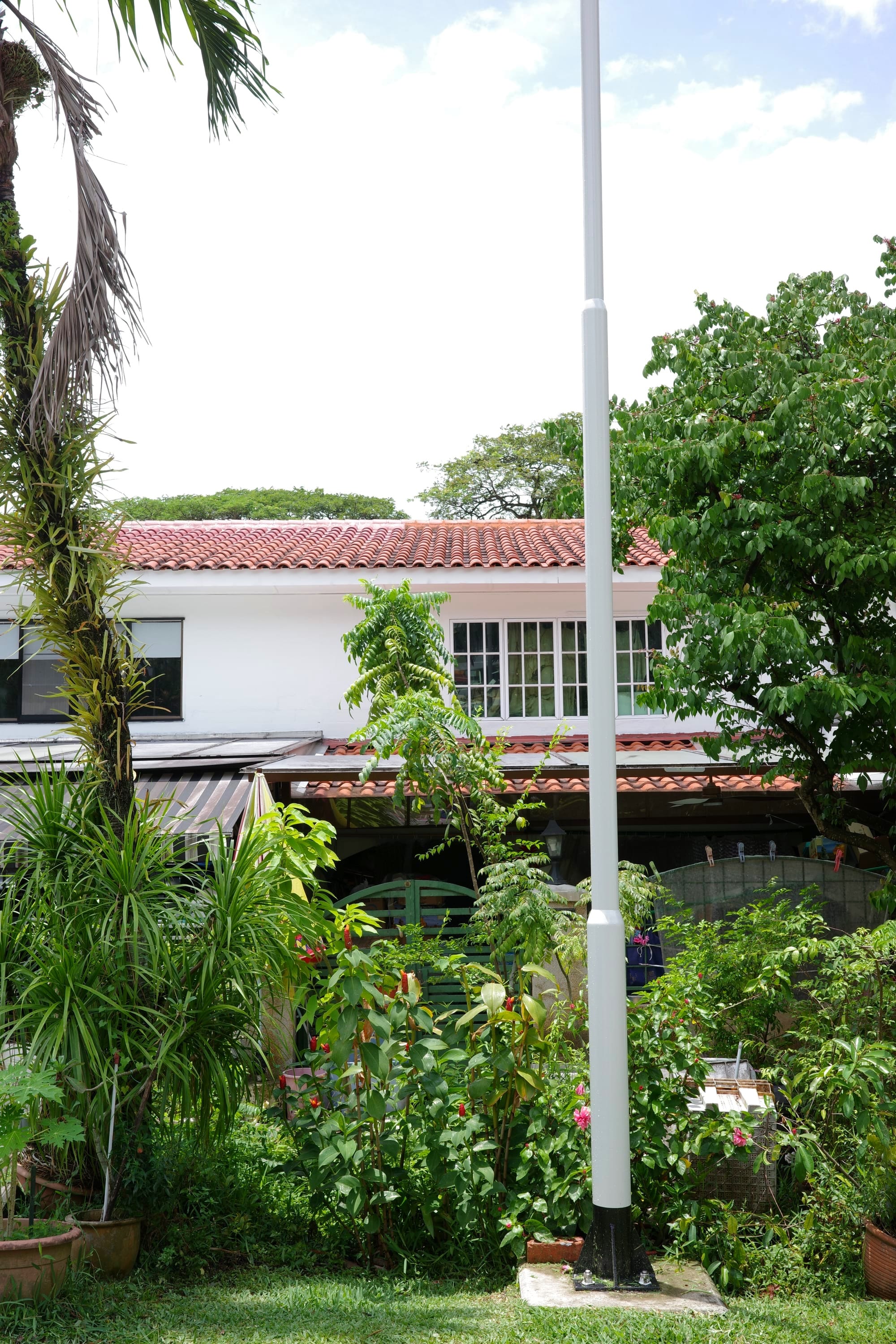 A 2-storey house hidden by lush vegetation
