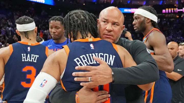 Rick (father) hugs Jalen (son).