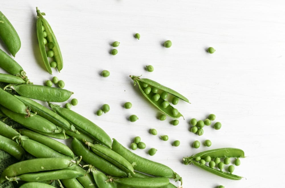 a pile of peas and peas on a table