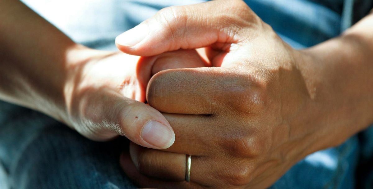 a man and a woman holding hands