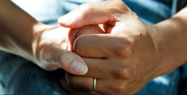 a man and a woman holding hands