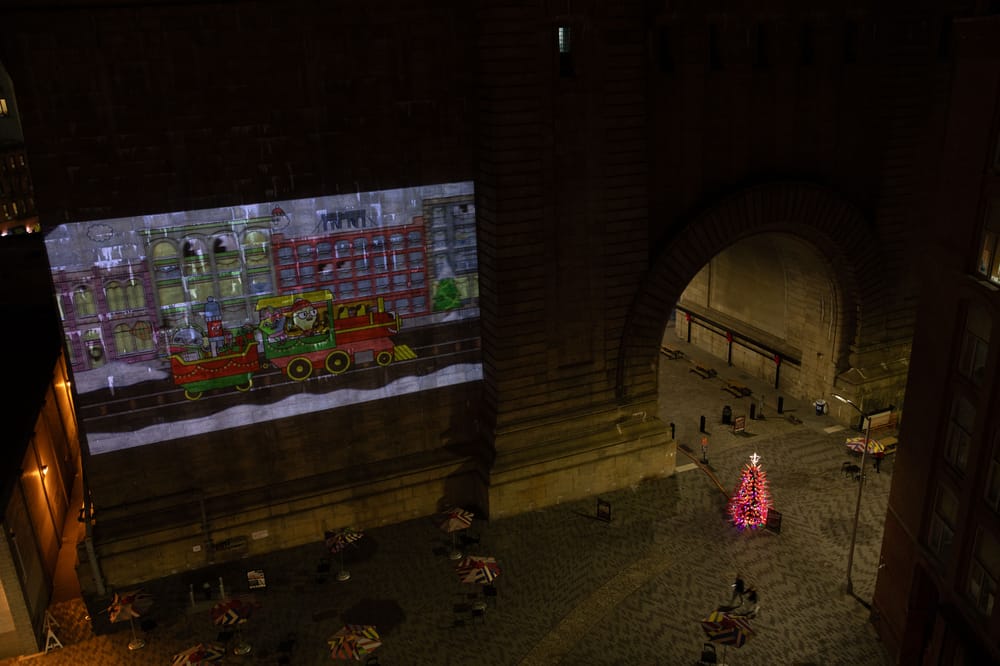 Construction Cone tree and projections on the anchorage of the Manhattan Bridge in Dumbo