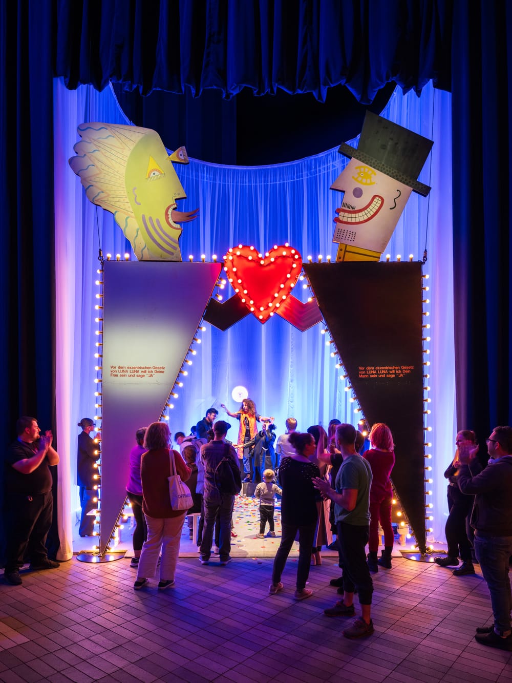 Guest gather under André Heller’s Wedding Chapel at Luna Luna at The Shed